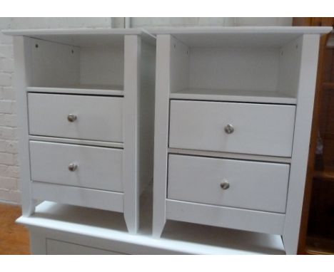 A pair of white bedside tables with one shelf over two drawers, 46 x 37 x 64cmH each