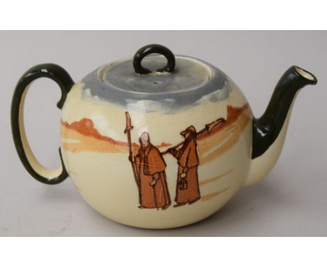 A Royal Doulton teapot, decorated with a brown wash on an ivory background with pilgrims or monks and with green spout and ha