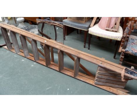 A vintage Twyford wooden step ladder, around 7ft high, together with a chrome metal fire guard