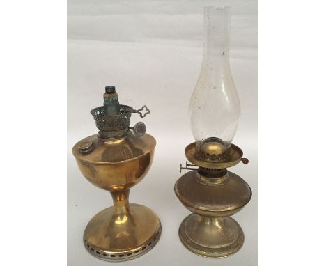 A brass twin burner oil lamp with a glass chimney, 43cmH, and a vintage brass oil lamp, 31cmH