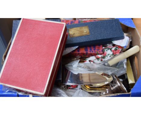 A substantial collection of silver plated and brass flatware, mostly knives, forks and spoons, some with bone resin handles o
