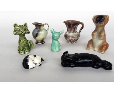 A small selection of ceramic ornaments, including two cats, a dog, a rabbit, a small jug 7cmH and another small jug with top 