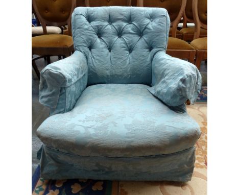 A small salon chair with button back and turned legs