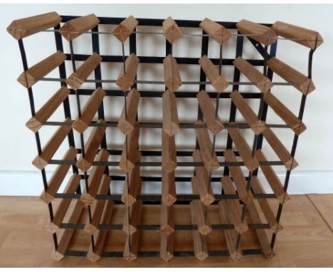 A metal and pine wine rack for 36 bottles