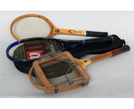 A vintage wooden Slazenger 'Jupiter' tennis racket with a wooden Dunlop racket press and a wooden Slazenger 'Professional' ra