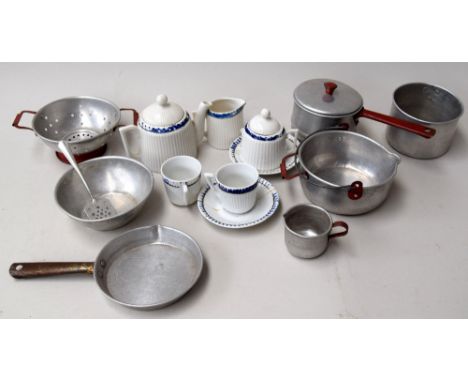 A child's tea set and cooking implements, to include cups, saucers, teapot, pans, utensils etc.