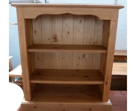 A pine hanging shelf, 63cmW and 78cmH, together with a small pine bookshelf, 25 x 62 x 76cmH