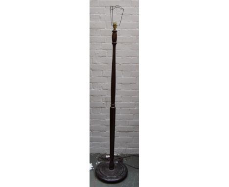 A vintage floor lamp with a dark wood turned column and circular base, 145cmH to the top of the column