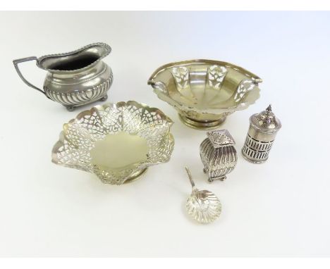 Two sterling silver pepperettes, along with a damaged silver caddy spoon, and three silver plated items , 74 grams 
