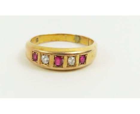 A late 19th or early 20th century ruby and diamond five stone ring, finger size Q, tests as 18-22ct gold, 4.9g gross