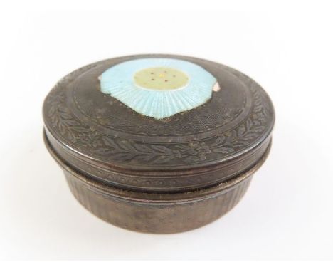 A French silver circular box, engine turned decoration, with remnants of enamel, approximately 5.4 cm diameter, 46 g gross 