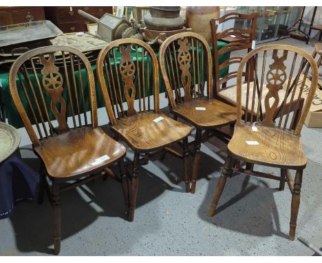 A mahogany ladder back chair with drop in seat together with a set of four wheel back Windsor chairs (5)