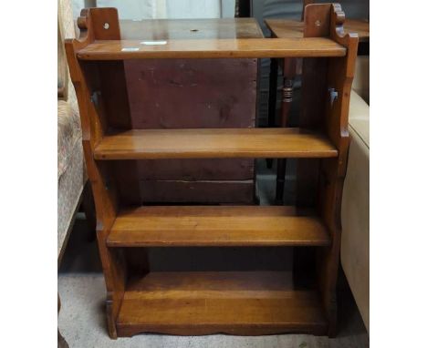 A late Victorian floor standing four shelf bookstand with pierced sides, 92cms high 64.5cms wide 16cms deep