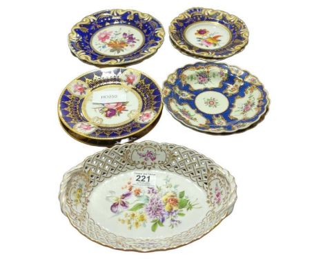 A pair of Chamberlains, Worcester dessert plates withpainted floral decoration, deep blue and gilt bands, 19cms diam together