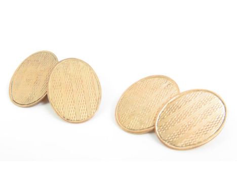 A pair of 9ct gold oval chain link cufflinks, with engine turned decoration, Chester hallmark, 4.6g gross
