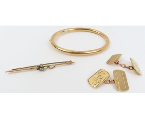 A pair of 9ct gold cufflinks, an early 20th century 9ct gold bar brooch set with light blue stones, 8.31g gross and an unmark