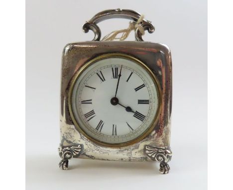 A late Victorian silver carriage clock, by O. C. Co, Birmingham 1900, with a fixed handle and on claw supports, approximately