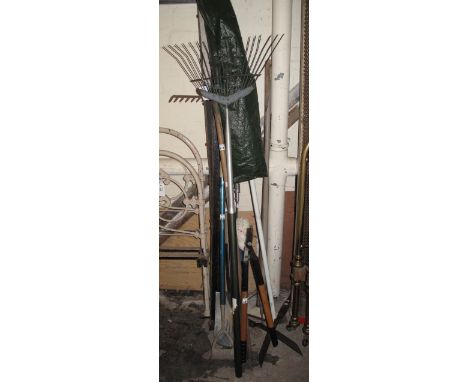 Good collection of assorted garden tools to include: loppers; lawn rake; stainless steel spade; shears; parasol etc. Together