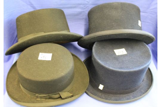 Two Daily Mail Sandringham hats together with two navy coloured top hats.  (4)