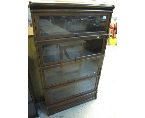 Early 20th Century oak globe Wernicke four tier glazed bookcase.