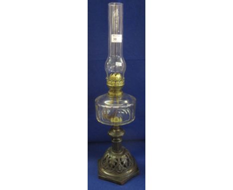 Early 20th Century Duplex double burner oil lamp with clear reservoir raised on hexagonal metal base. 