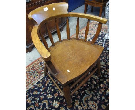 Mid Century oak smoker's bow type elbow chair.