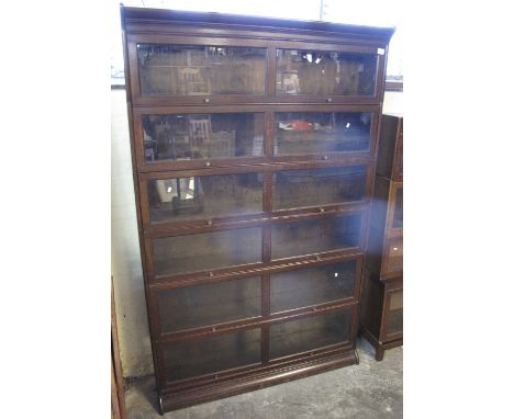 Mid Century Globe Wernicke style oak six tier, glazed, double width bookcase. CONDITION REPORT: Decent finish and condition o