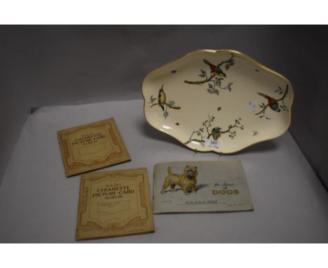 A fine ceramic dish having decorated bird design stamped Copeland to reverse with cigarette albums