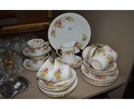An early 20th century part tea service having hand decorated floral pattern