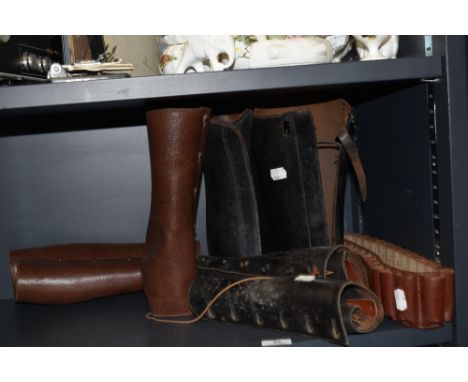 A selection of 20th century leather gaitors and ammunition belt