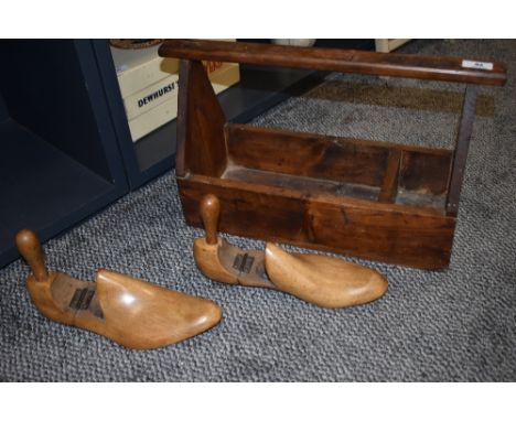 A vintage pine tool or garden carry case with a pair of shoe last