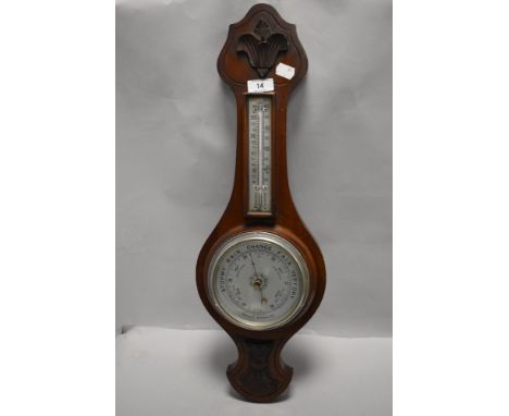 An Edwardian oak cased aneroid barometer