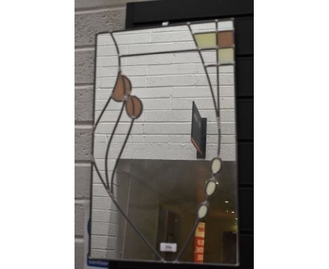 A modern hall way mirror having a Mackintosh style leaded light design