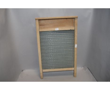 A vintage wooden framed and glass washboard