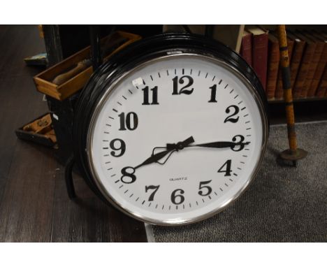 A large sized wall clock in a traditional design