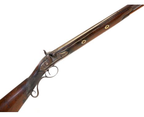Percussion shotgun, converted from a flintock, with 30 inch Damascus Spanish form barrel, chequered stock with scroll pineapp