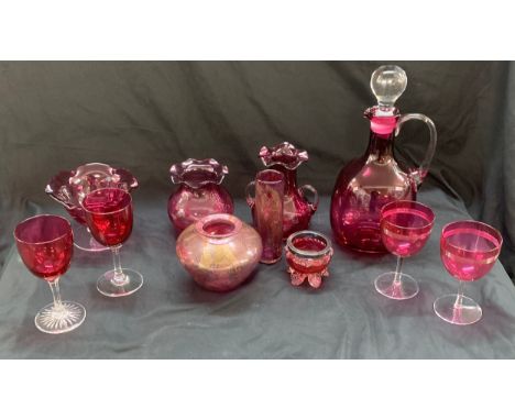 Selection of cranberry glass ware to include a decanter, jugs, trifle dishes etc 