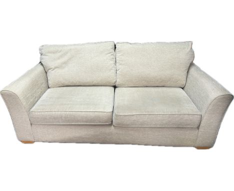 Cream fabric 2 seater sofa approxiamte measurements: Height 27 inches, Width 80 inches, Depth 36 inches 