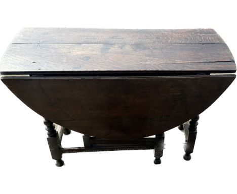 Oak period drop leaf gate leg table measures approx 20 inches tall, 18 deep and 42 wide 