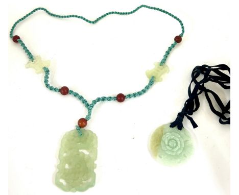 Chinese carved and pierced Jade pendant necklace  60 X 40MM, in design of a phoenix, on a cord necklace linked by 2 jade plaq