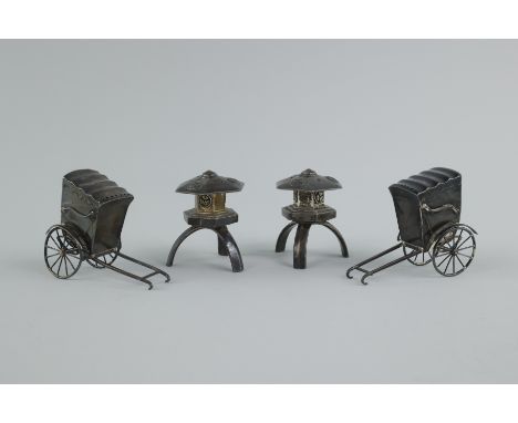 Two sets of 950 sterling silver salt and pepper shakers made in Japan. The first set is shaped like a street cart a human or 