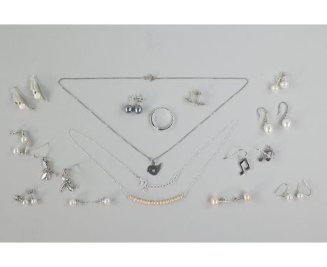 Twelve pair of earrings: Seven are studs with pearls and four are fishhook with pearl and one is fishhook without stone. Two 