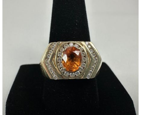 14KT gold tested and marked size 11 ring. The oval citrine center stone is approximately 6.24 x 8.20 mm, and there are sixtee