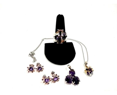 Includes a sterling silver necklace with a cable chain and trigger clasp, and has a pendant attached with a rough-shaped purp