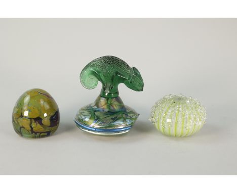 Four pieces of sculpture. One has iridescent swirls and is signed and dated 1980. The second piece is inspired by the reef li