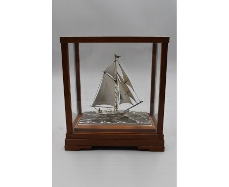 Modern Master of Traditional Japanese Silver craft, Seki Takehiko, created this miniature and intricate sterling sailboat. Th