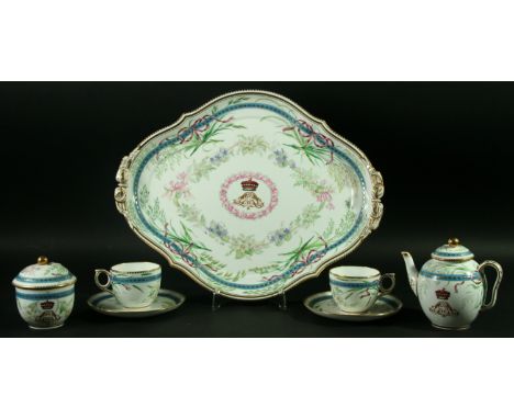 A ROYAL WORCESTER BREAKFAST SET painted with a central coronet above a monogram inside a floral and gilt border, comprising t