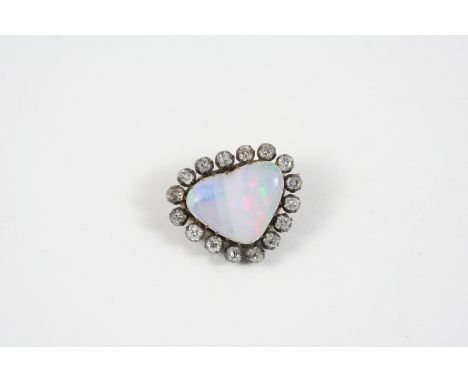 A VICTORIAN OPAL AND DIAMOND BROOCH the heart-shaped opal is set within a surround of old brilliant-cut diamonds, in silver a