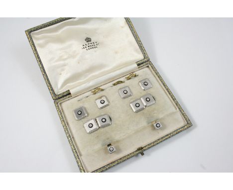 A CASED SET OF PLATINUM, DIAMOND AND BLACK ONYX CUFFLINKS AND DRESS STUDS each square-shaped platinum link with engine turned