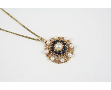 A SAPPHIRE AND CULTURED PEARL PENDANT the gold flower head is centred with a cultured  pearl within a surround of circular-cu